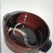 Artisanal sandstone dish signed Guibert red brown decorated