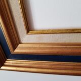 Framed black gilded wood and cream fabric