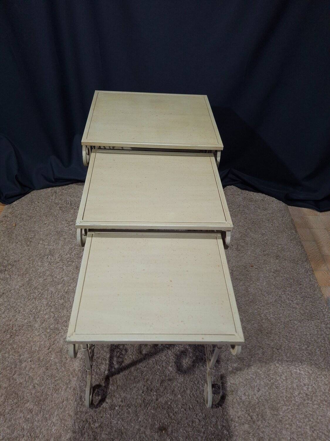 Nesting tables in patinated iron.