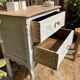 Adorable small chest of drawers or weathered white console.