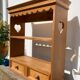 Wall shelf in raw wood with drawers and openwork hearts