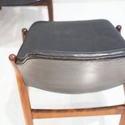 Set of four Arne Vodder chairs in hardwood and black leather.
