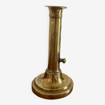 Old brass push candle holder