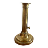 Old brass push candle holder