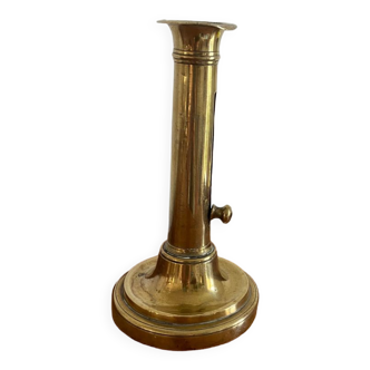 Old brass push candle holder