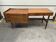 Scandinavian mid-century desk with a cabinet and mahogany finish.
