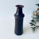 Tubular vase in glazed brown sandstone