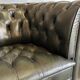 Title: Pair of vintage olive green leather Chesterfield armchairs