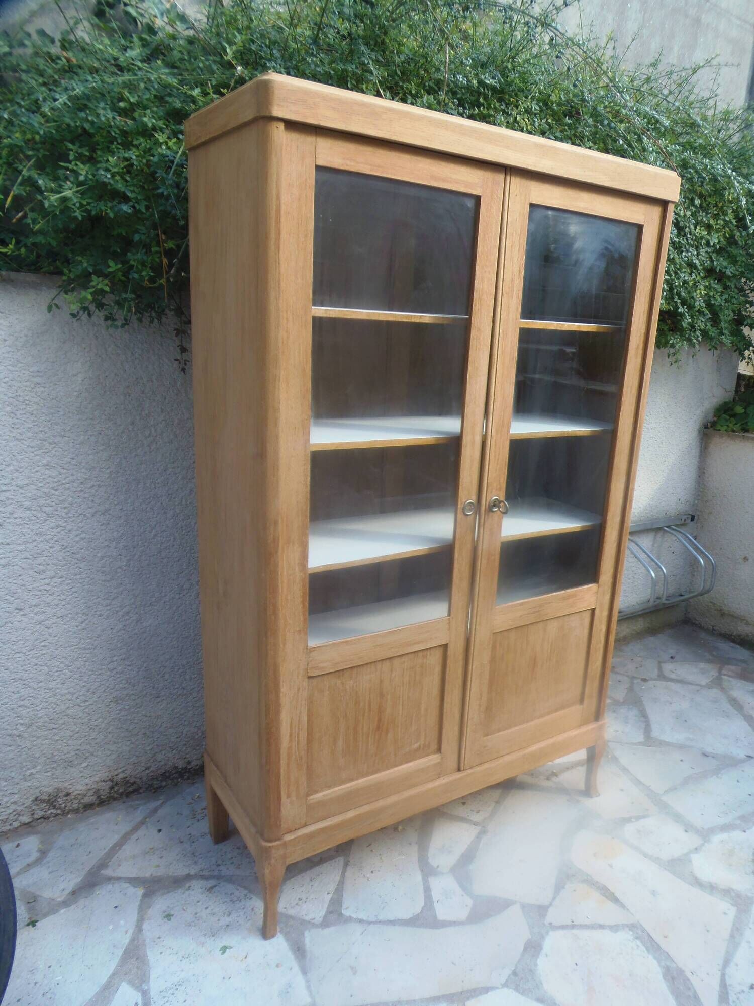 Charming vintage display cabinet from the 1950s in natural wood.