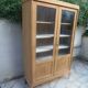 Charming vintage display cabinet from the 1950s in natural wood.