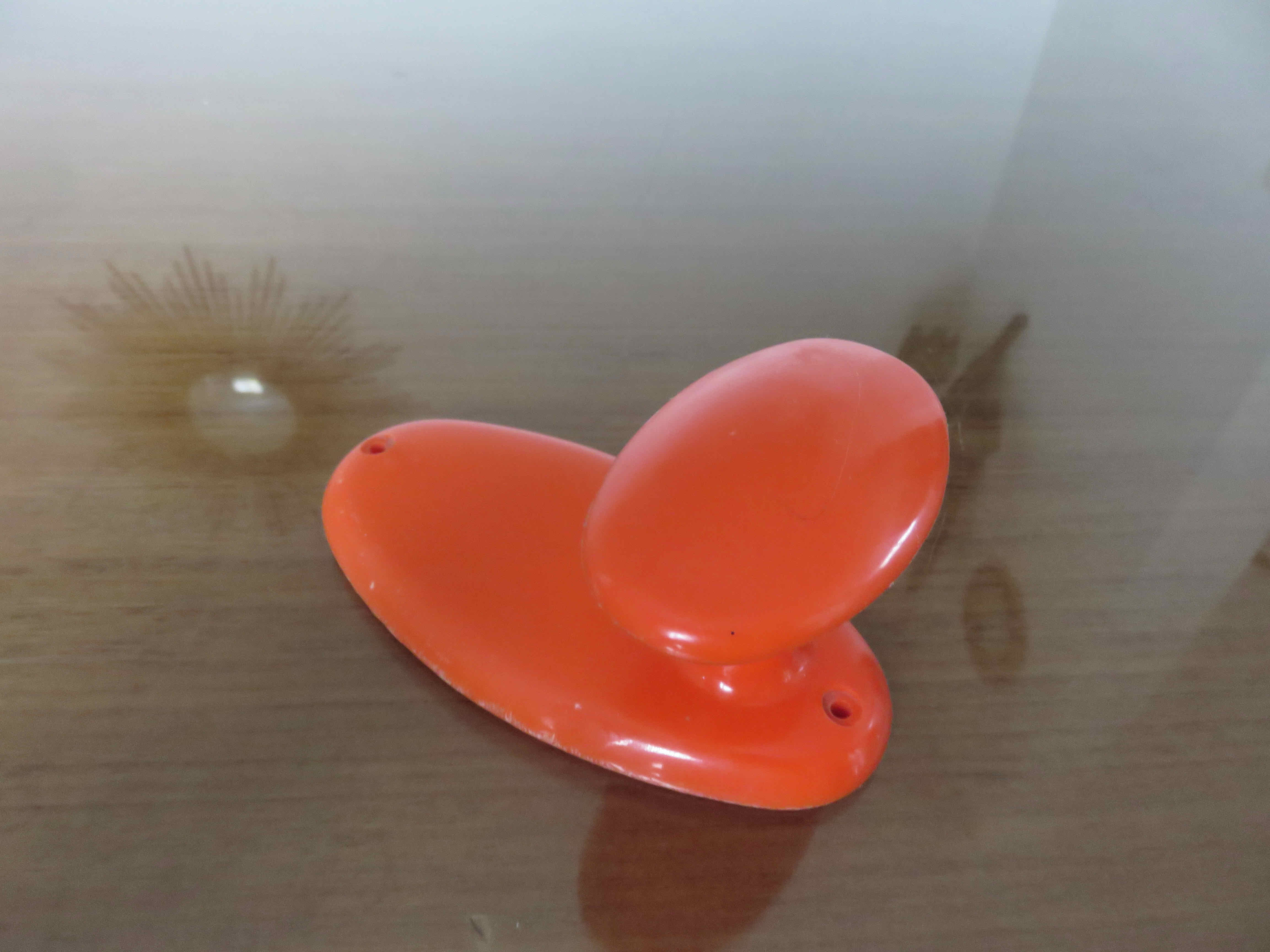 Orange plastic hook 70s