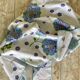 Nappe 70's "flower power" bleue & violette - 150x180 cm - polycoton