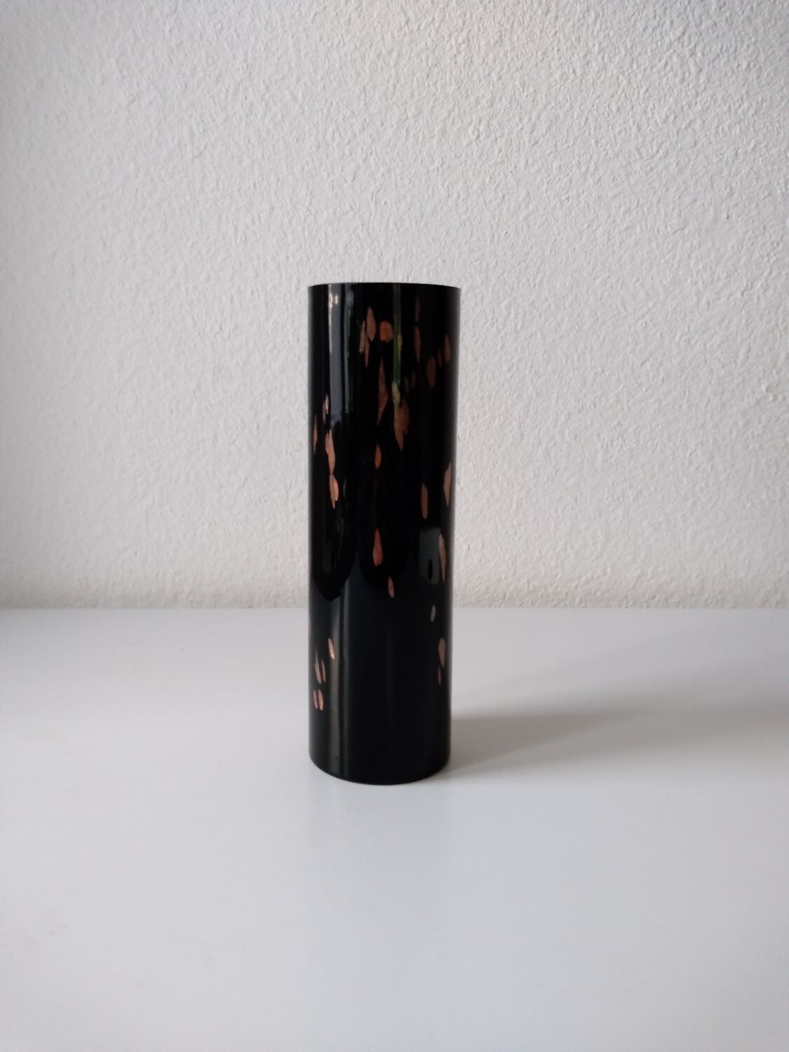 Black opaque glass vase with minimalist style copper inlays