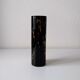 Black opaque glass vase with minimalist style copper inlays