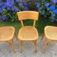 Trio de chaises cannées de style Bauman en hêtre non estampillées.