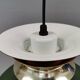 Hanging lamp in green lacquered metal with golden “ring” and bottom grille.