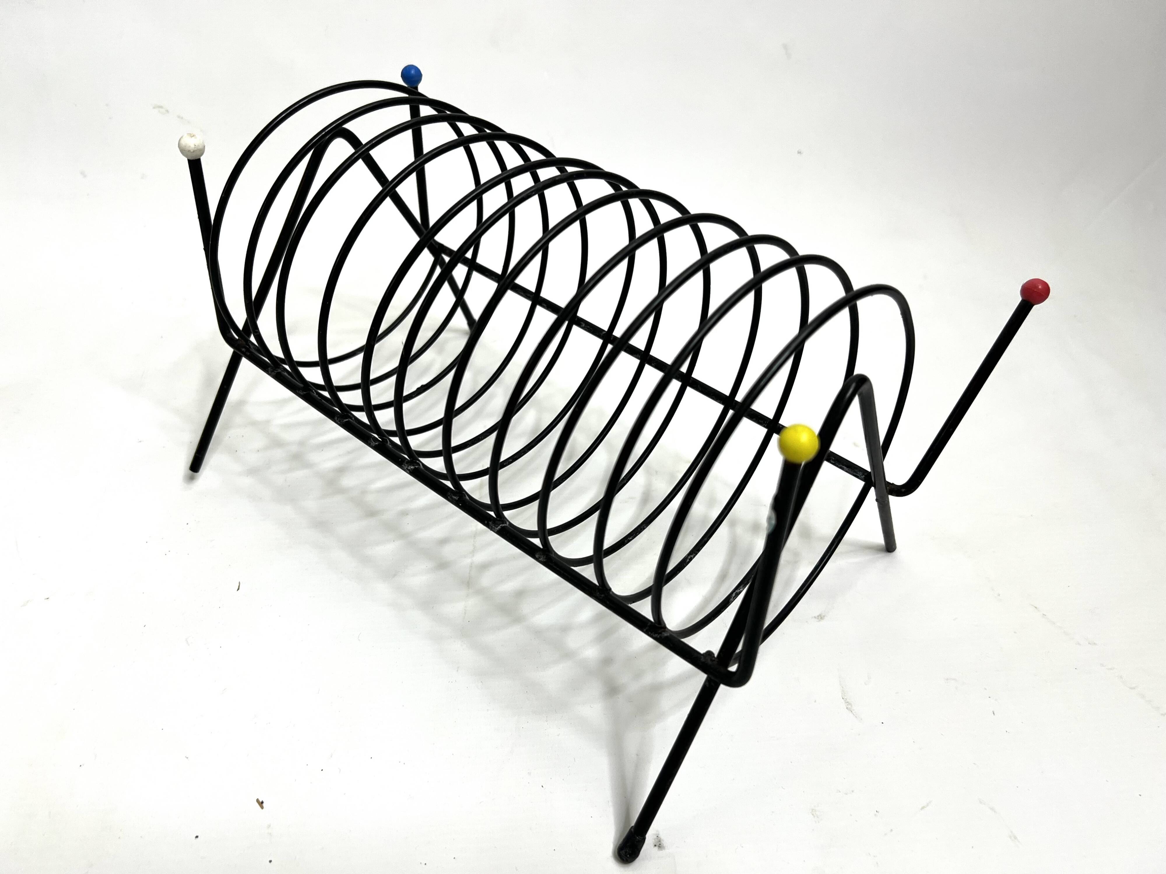 Porte-revues vintage en métal laqué noir – Design 1950s multicolore