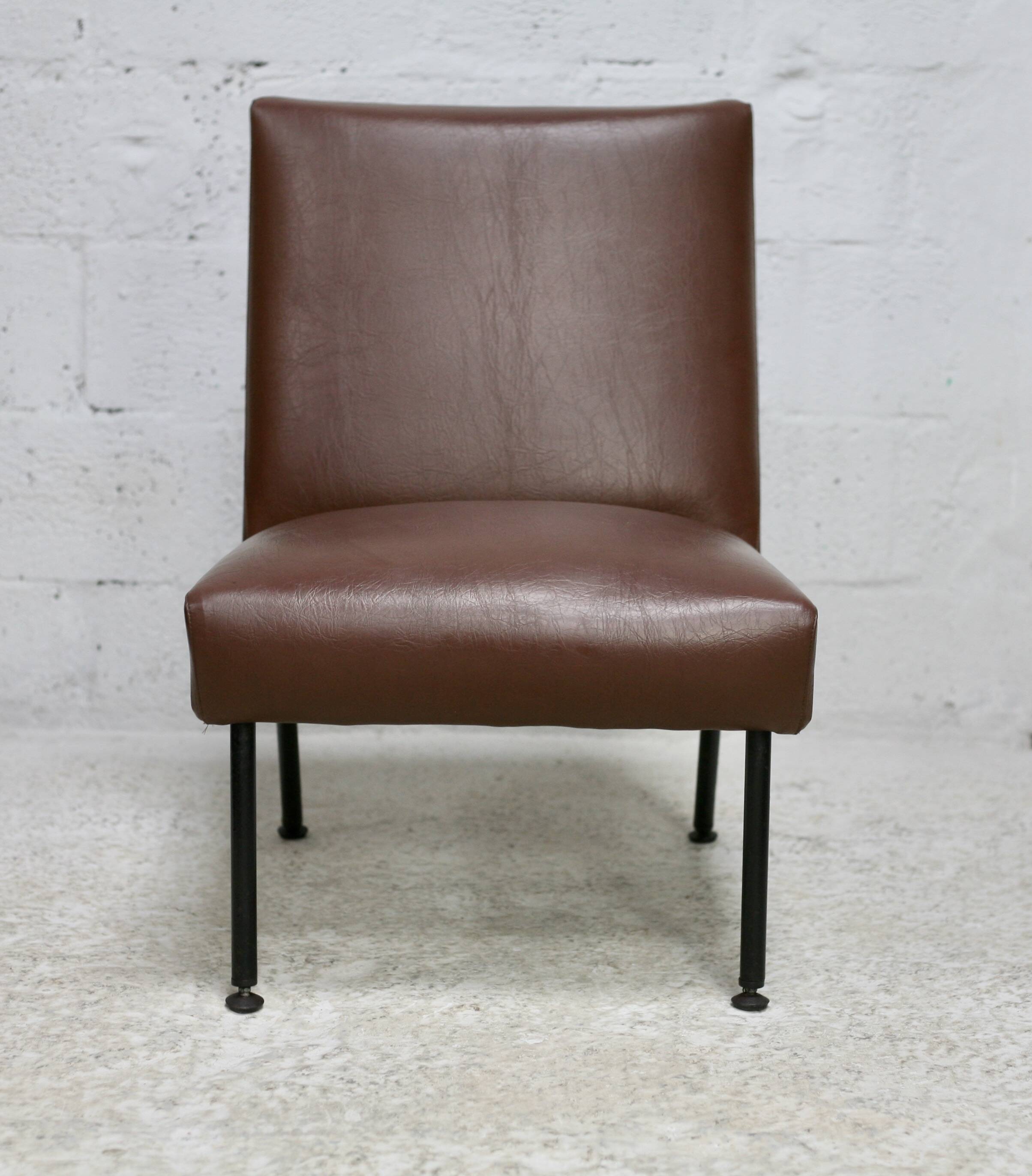 Low chair, circa 1950. Brown imitation leather.