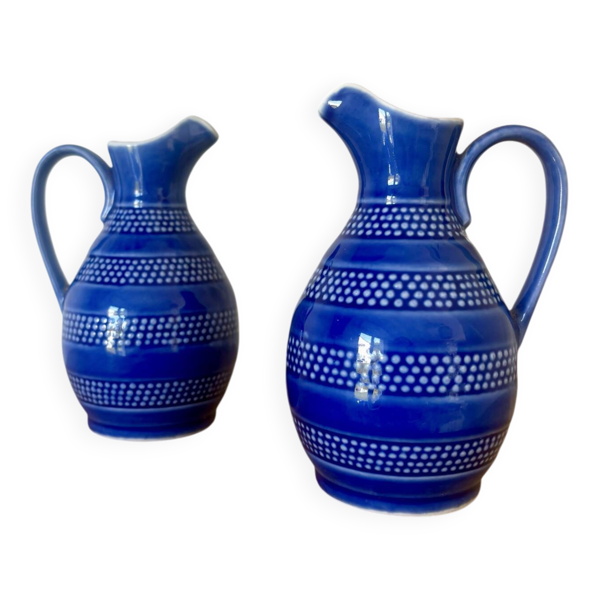 Set of two small 33 cl blue ceramic jugs.