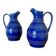 Set of two small 33 cl blue ceramic jugs.