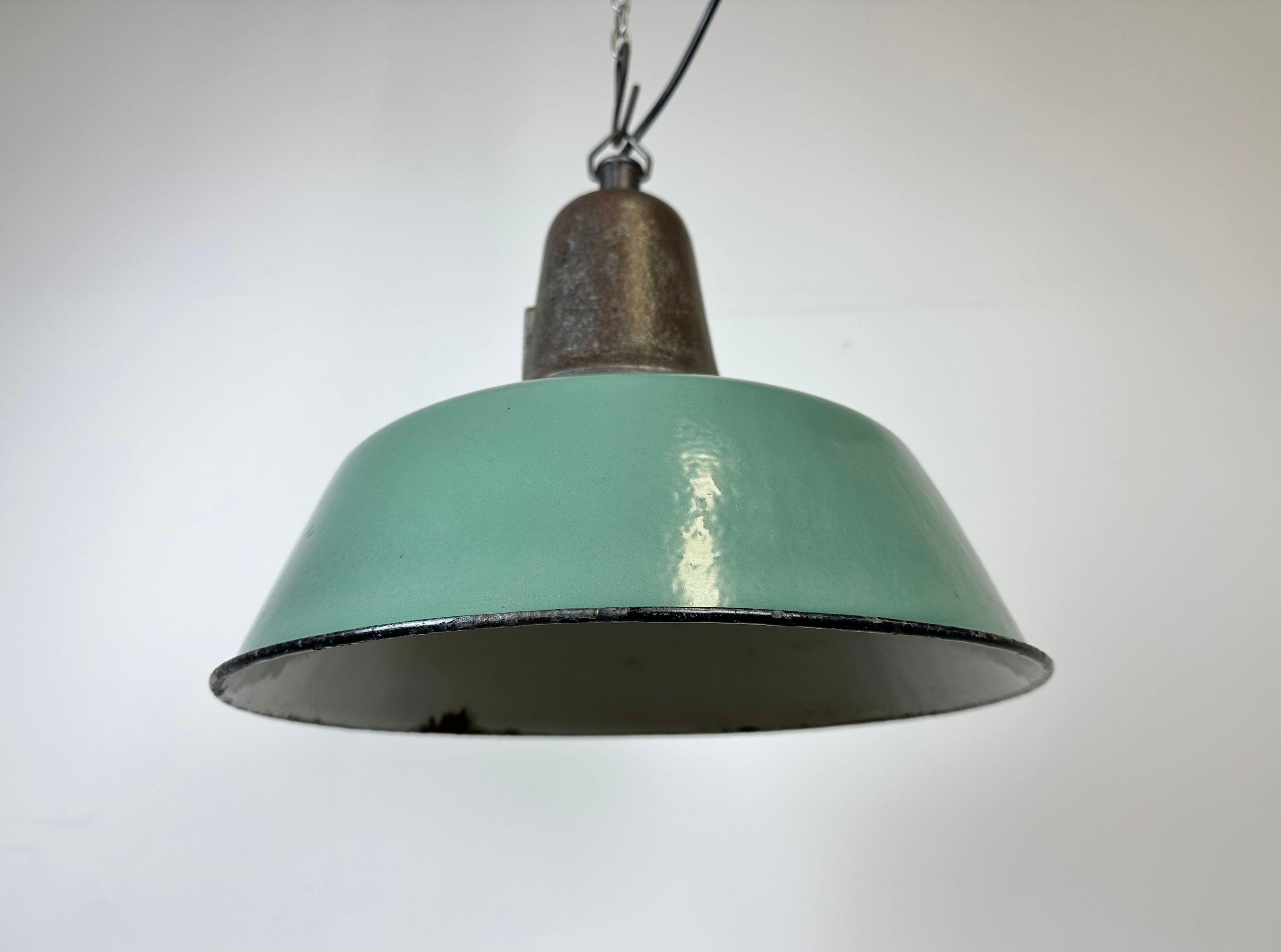 Industrial green enamel factory lamp with cast iron top, 1960s