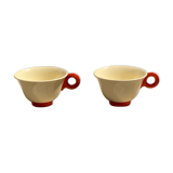 Two old orange handle cups