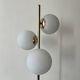 Cluster floor lamp with 3 spherical lamps in gold metal and white glass