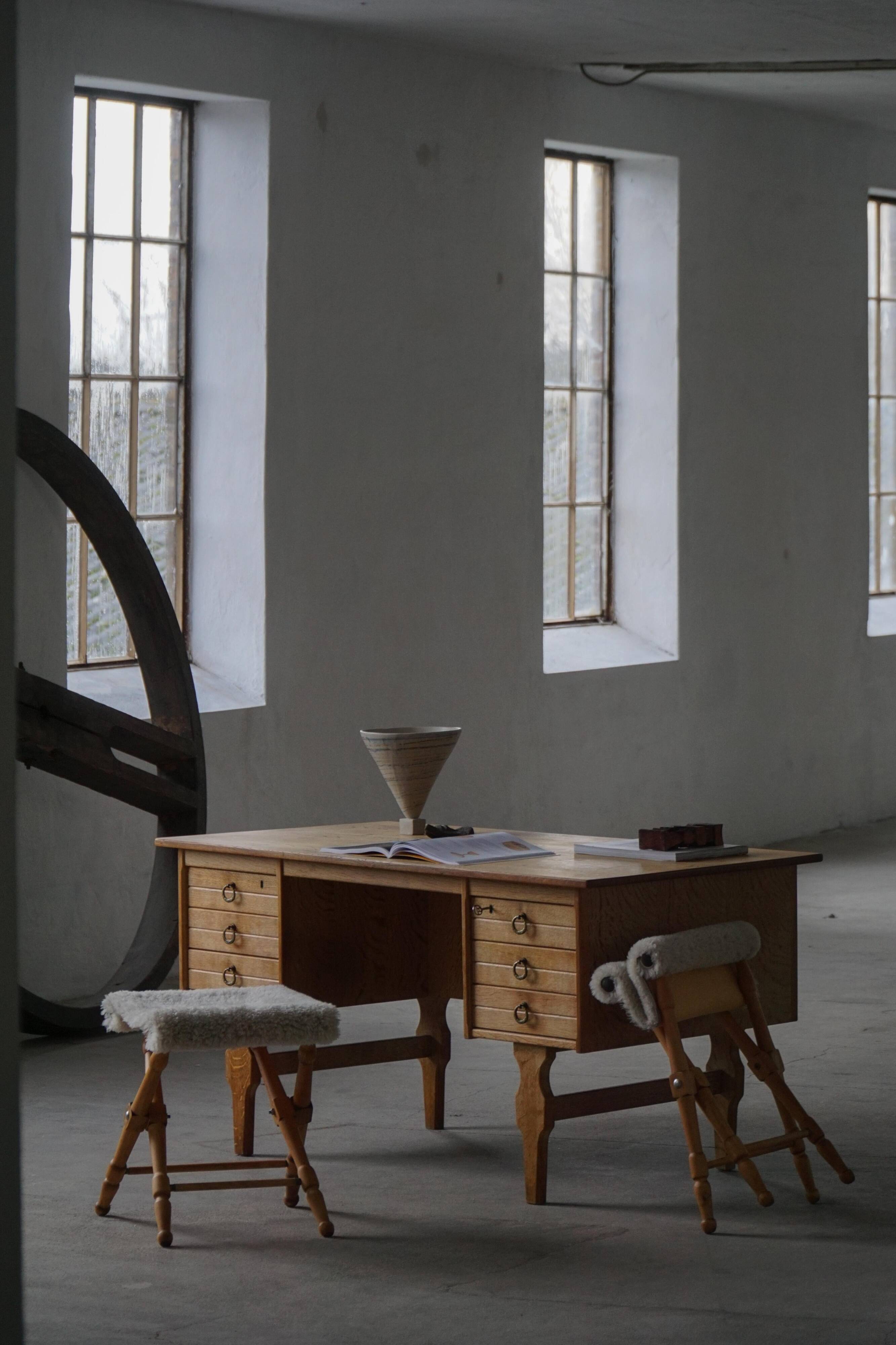 Pair of Danish mid-century folding stools with sheepskin upholstery, 1960.
