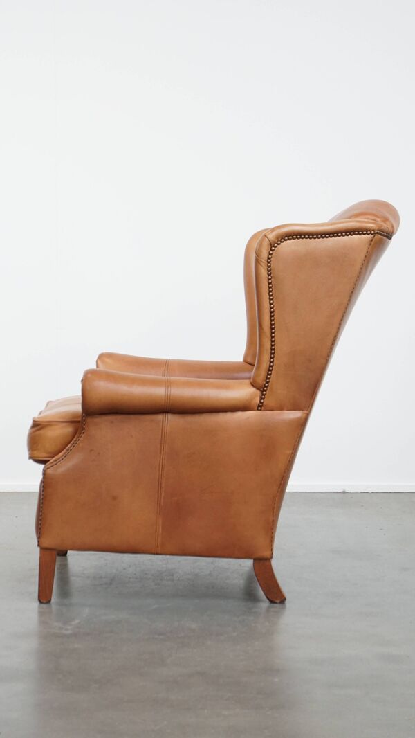 Fauteuil à oreilles en cuir de vache