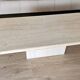 Beige travertine coffee table in the style of Italian design, 120 x 60 cm.