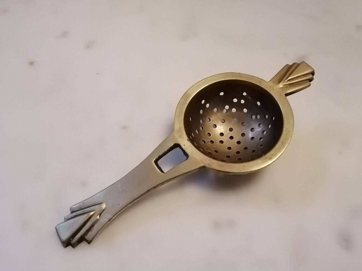 Art deco tea colander