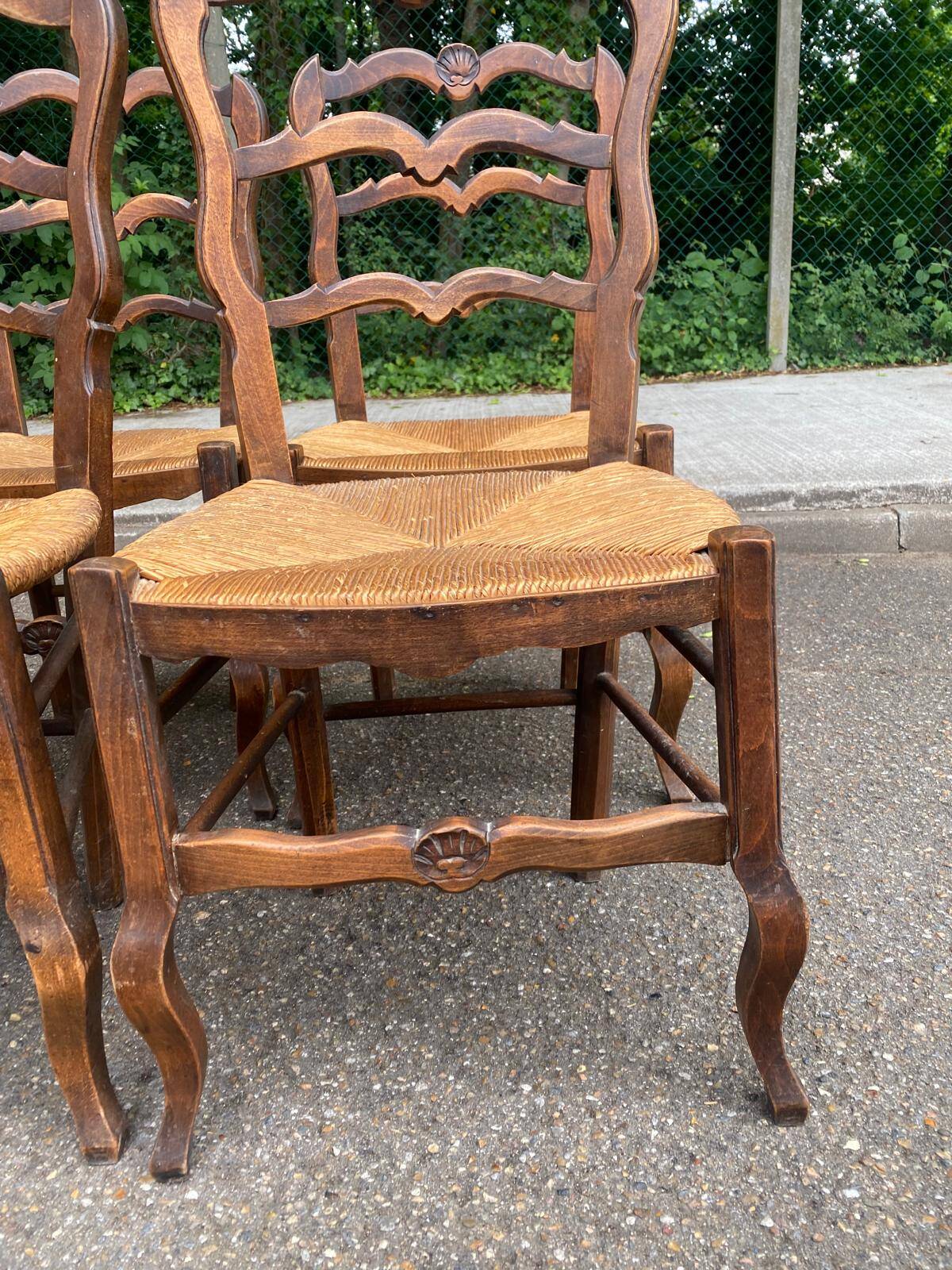 4 Louis XV chairs in solid carved oak with rush seats from the 19th century.