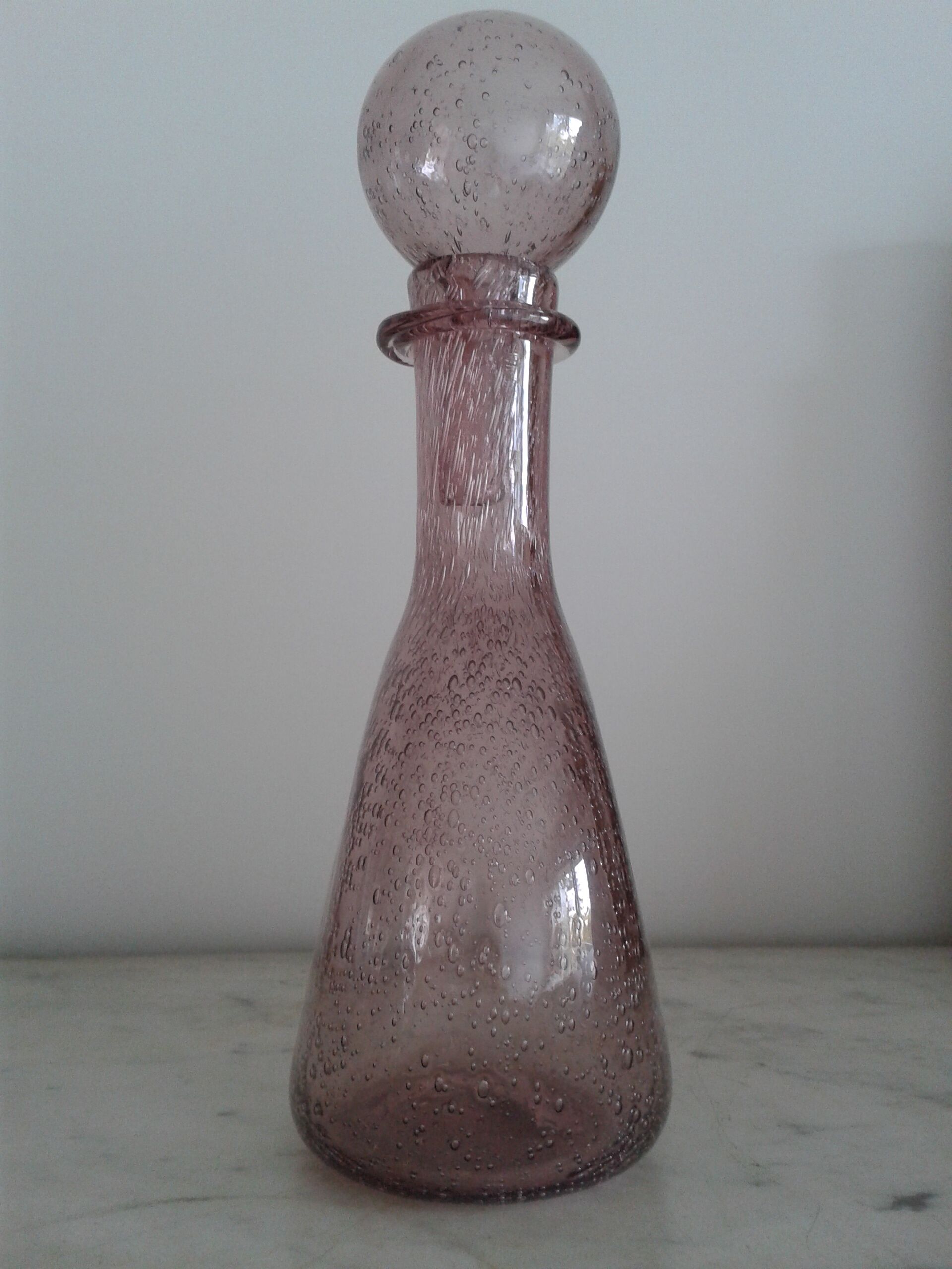 A bolted glass carafe