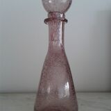 A bolted glass carafe