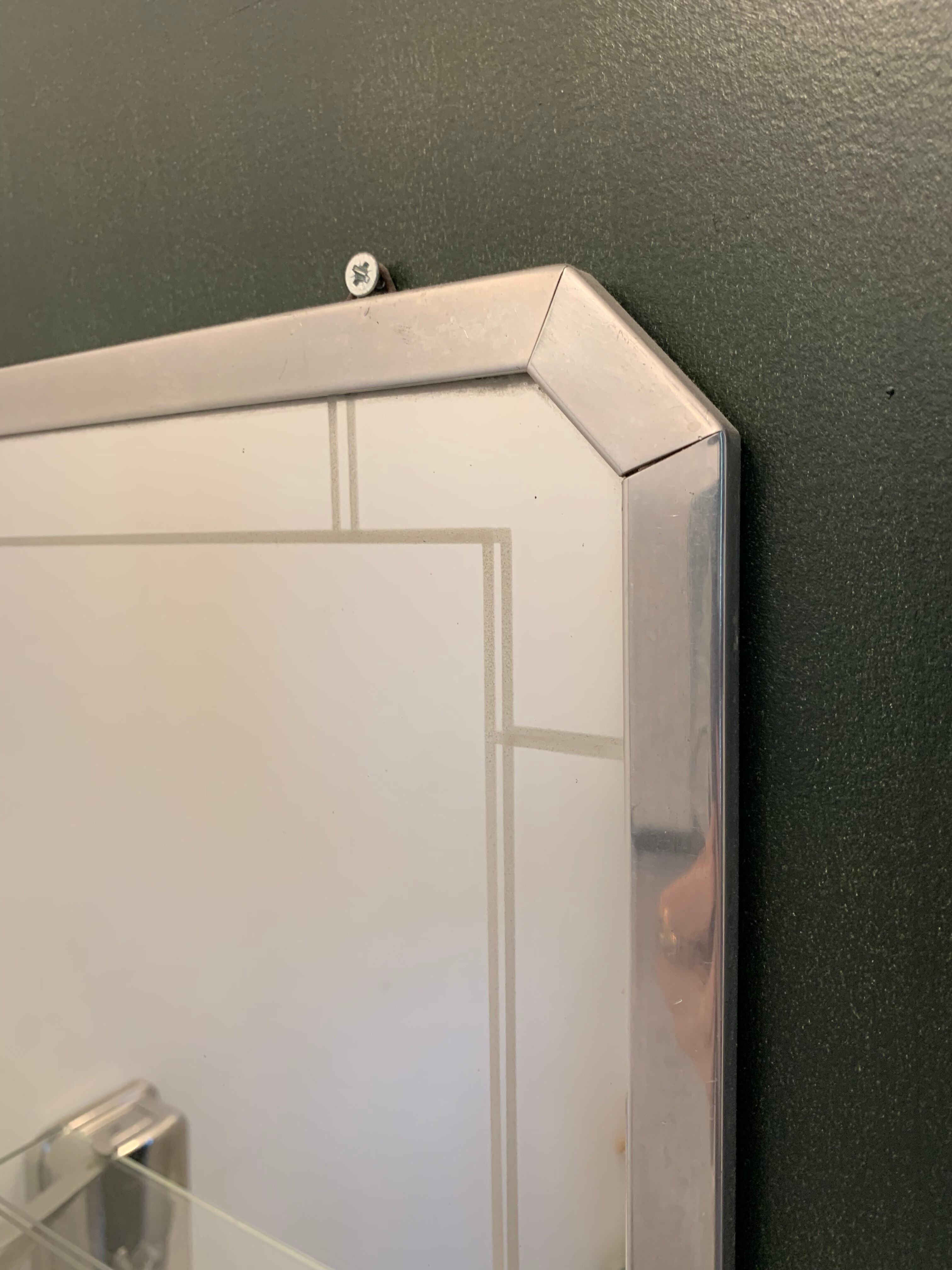 Bathroom mirror with art deco shelf