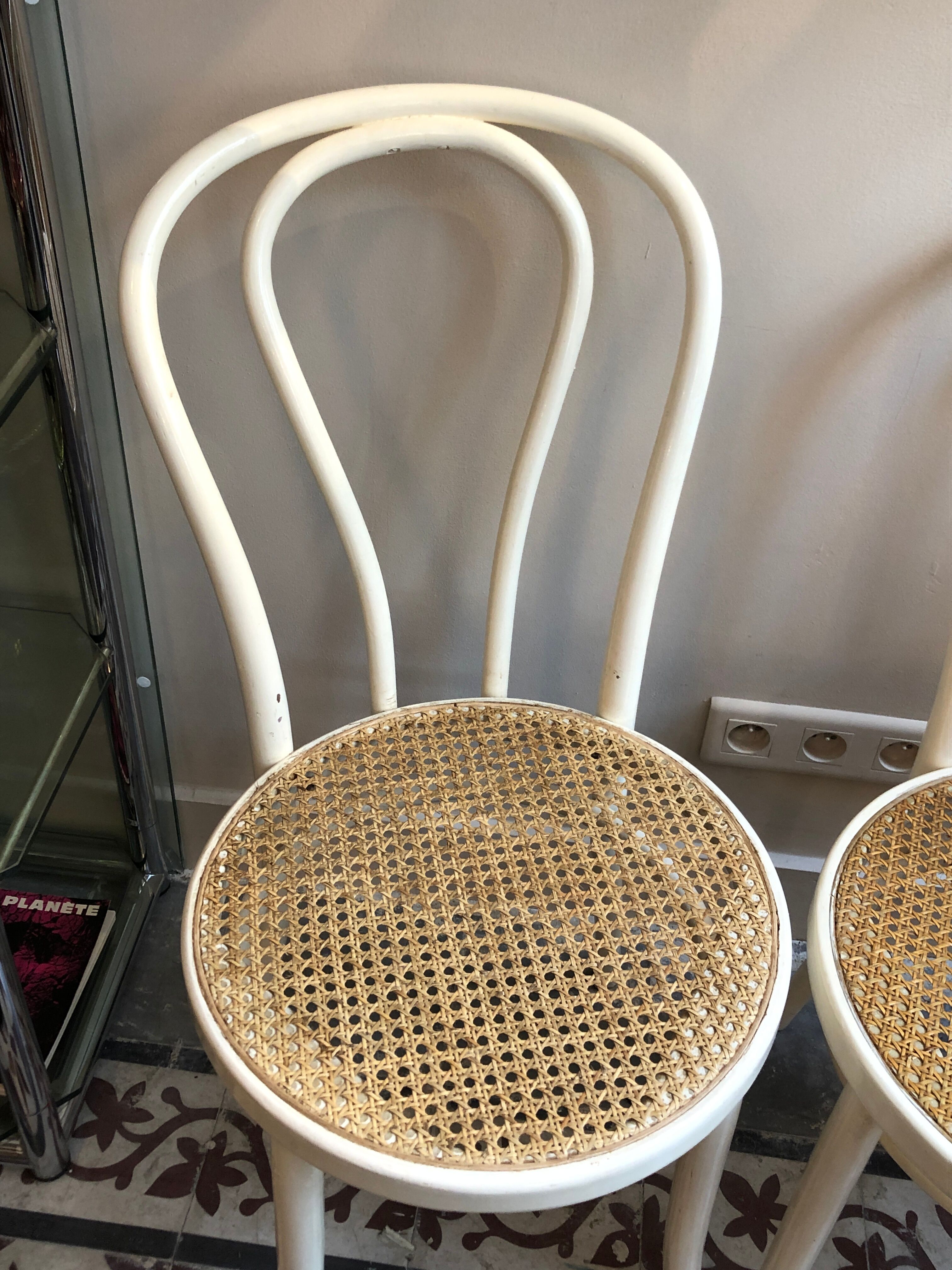 Couple of white bistro chairs