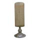Amber crackled glass photophore on a metal candlestick base.