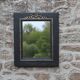 Vintage black and gold wooden mirror with a pediment – Napoléon III style