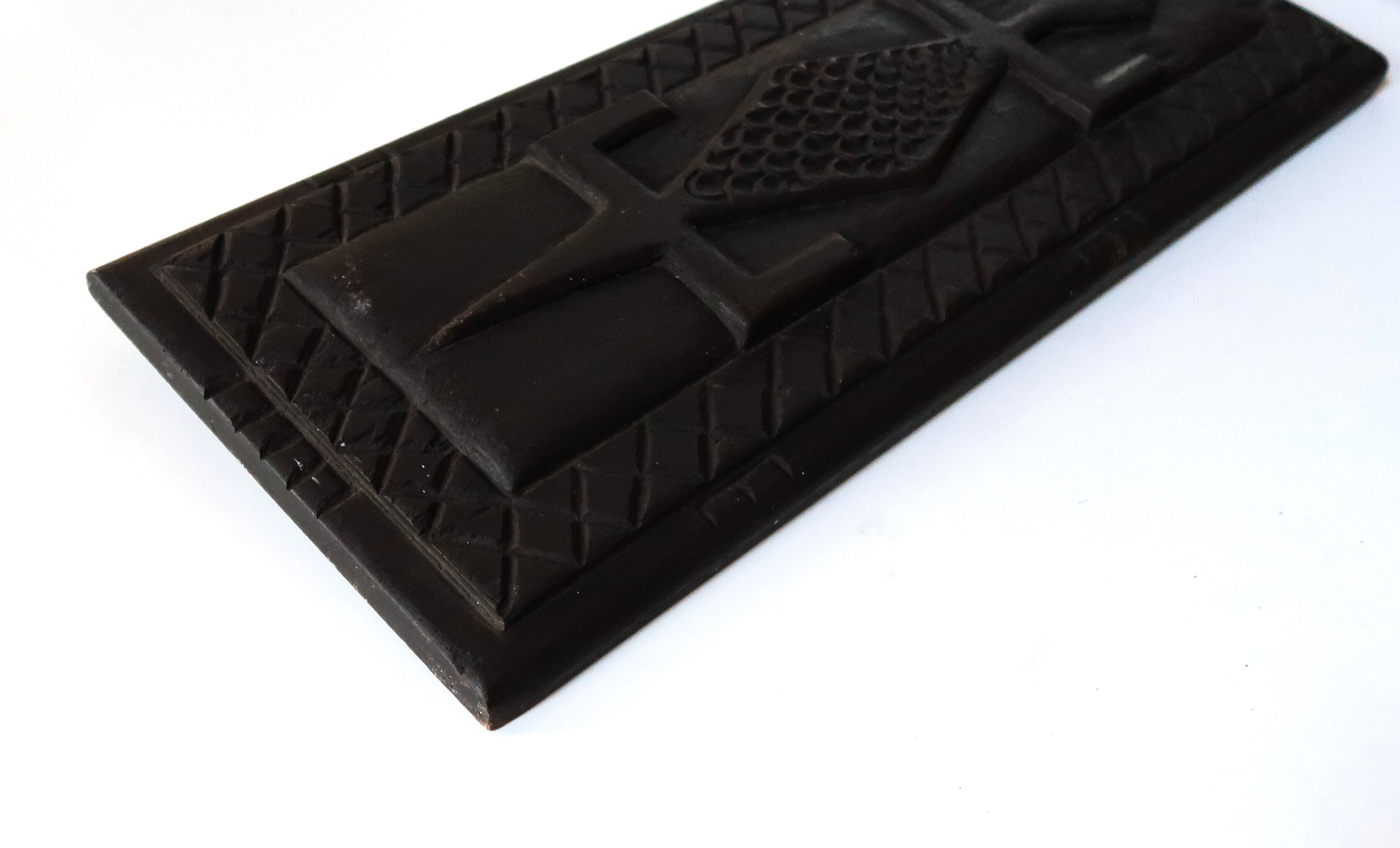 Carved African wall plate, door top