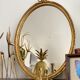 Golden oval mirror 32x44cm