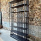 Large industrial black metal shelf – openwork graphic structure