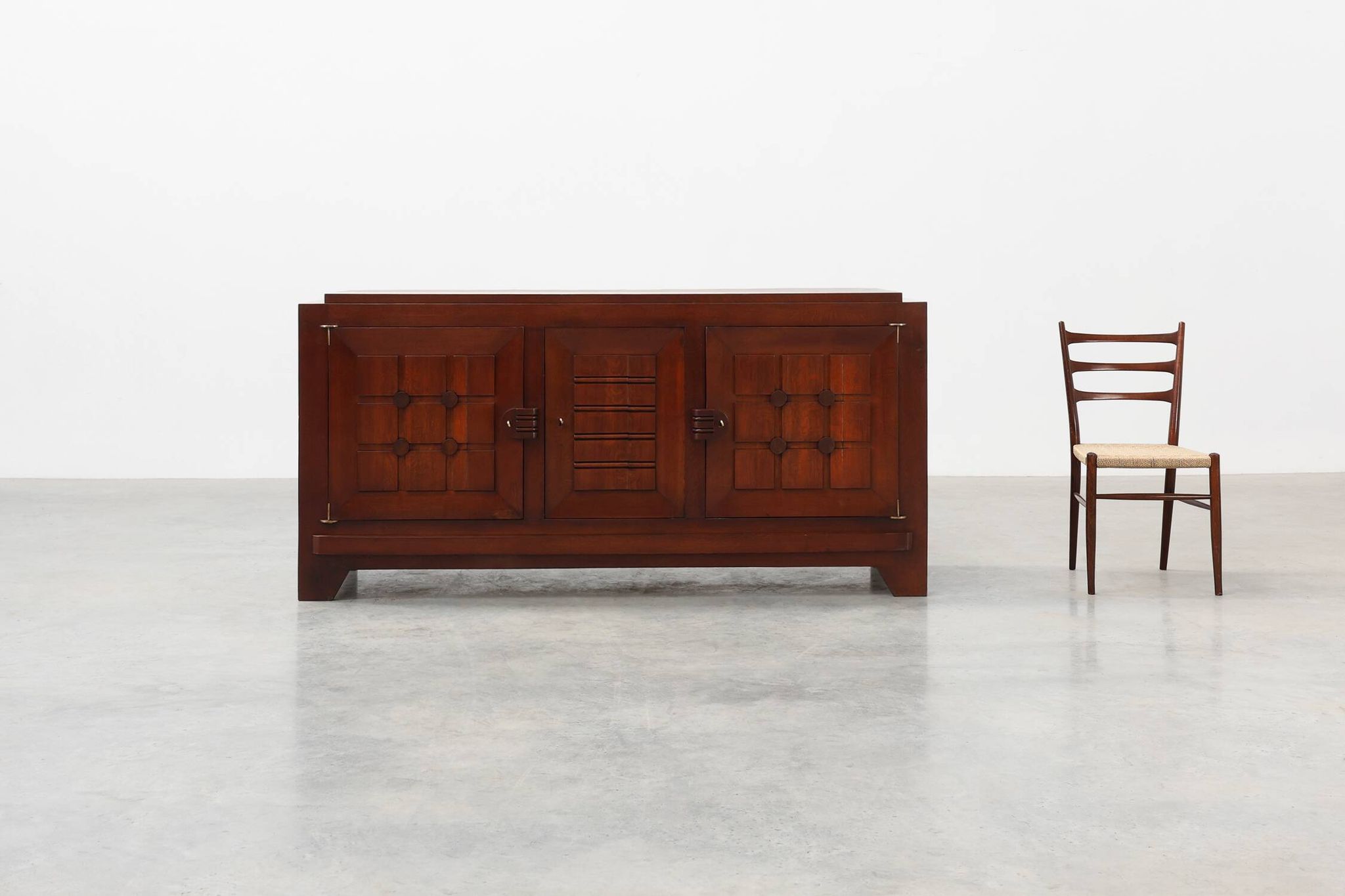 Art Deco carved geometric sideboard by Charles Dudouyt in oak, France ca. 1