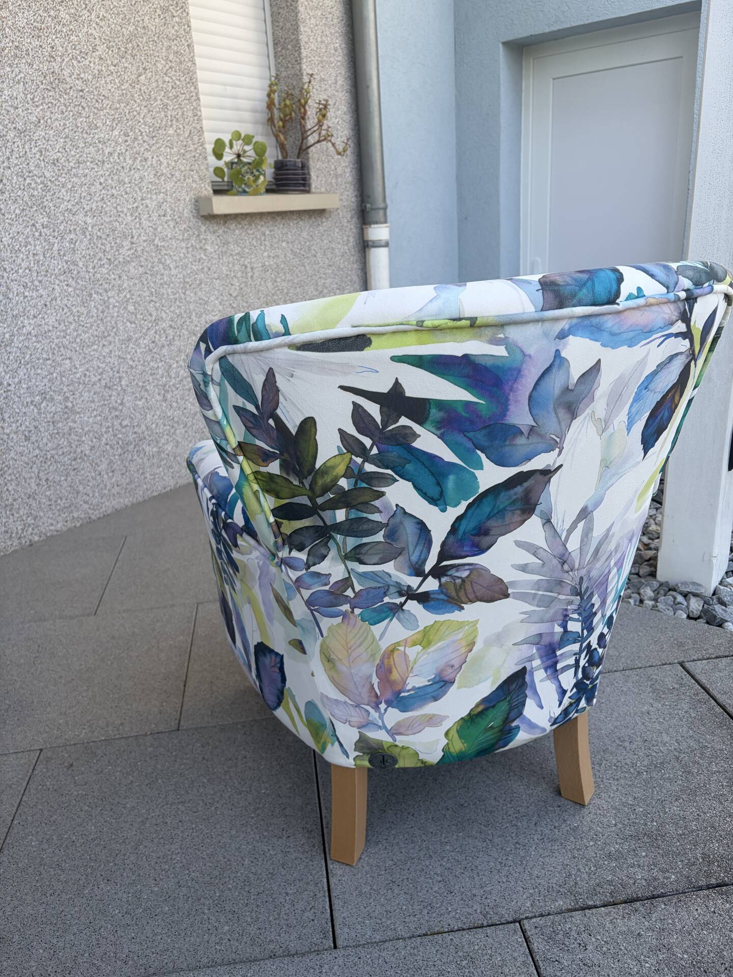 Contemporary ALC frog chair, reupholstered in watercolour floral fabric.