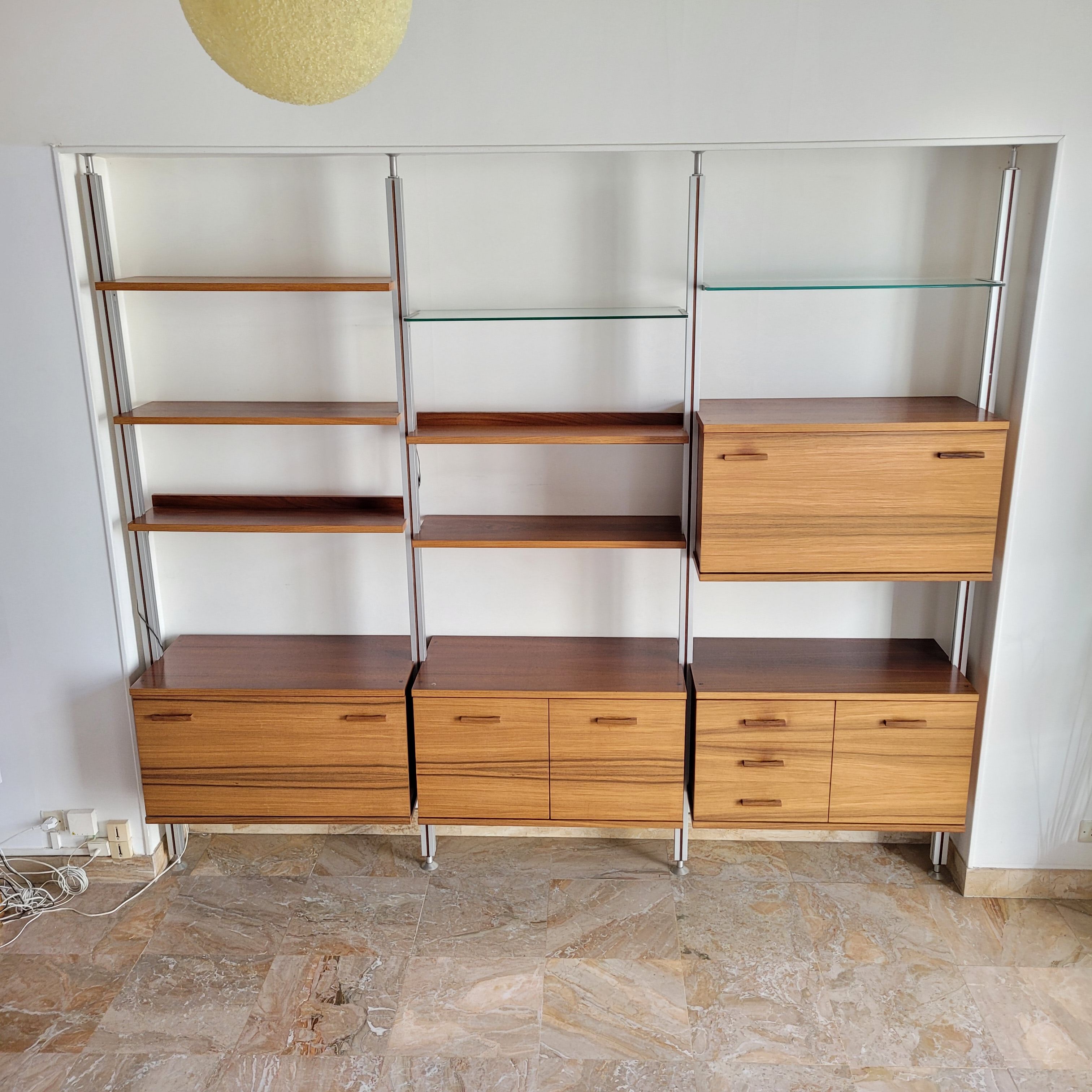 Large Scandinavian wall-mounted wood and aluminum bookcase circa 1960