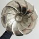 large dish on a shiny metal stand