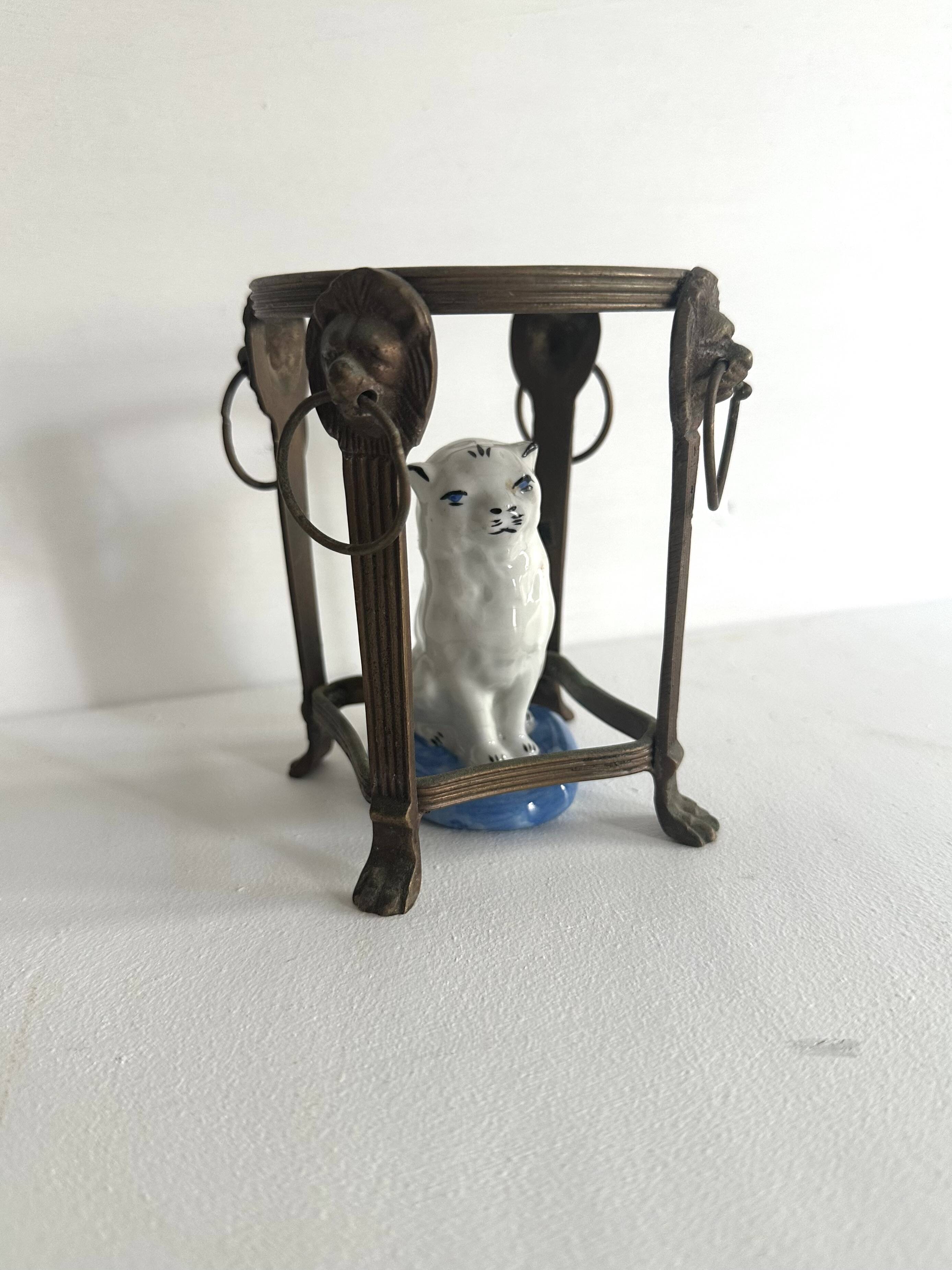 Small ancient glazed ceramic cat from the 19th century.