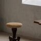 Adjustable Victorian-style piano stool with a jute fabric seat, early 20th century.