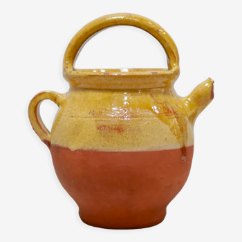 Old gargoulette pot in glazed terracotta