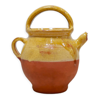 Old gargoulette pot in glazed terracotta