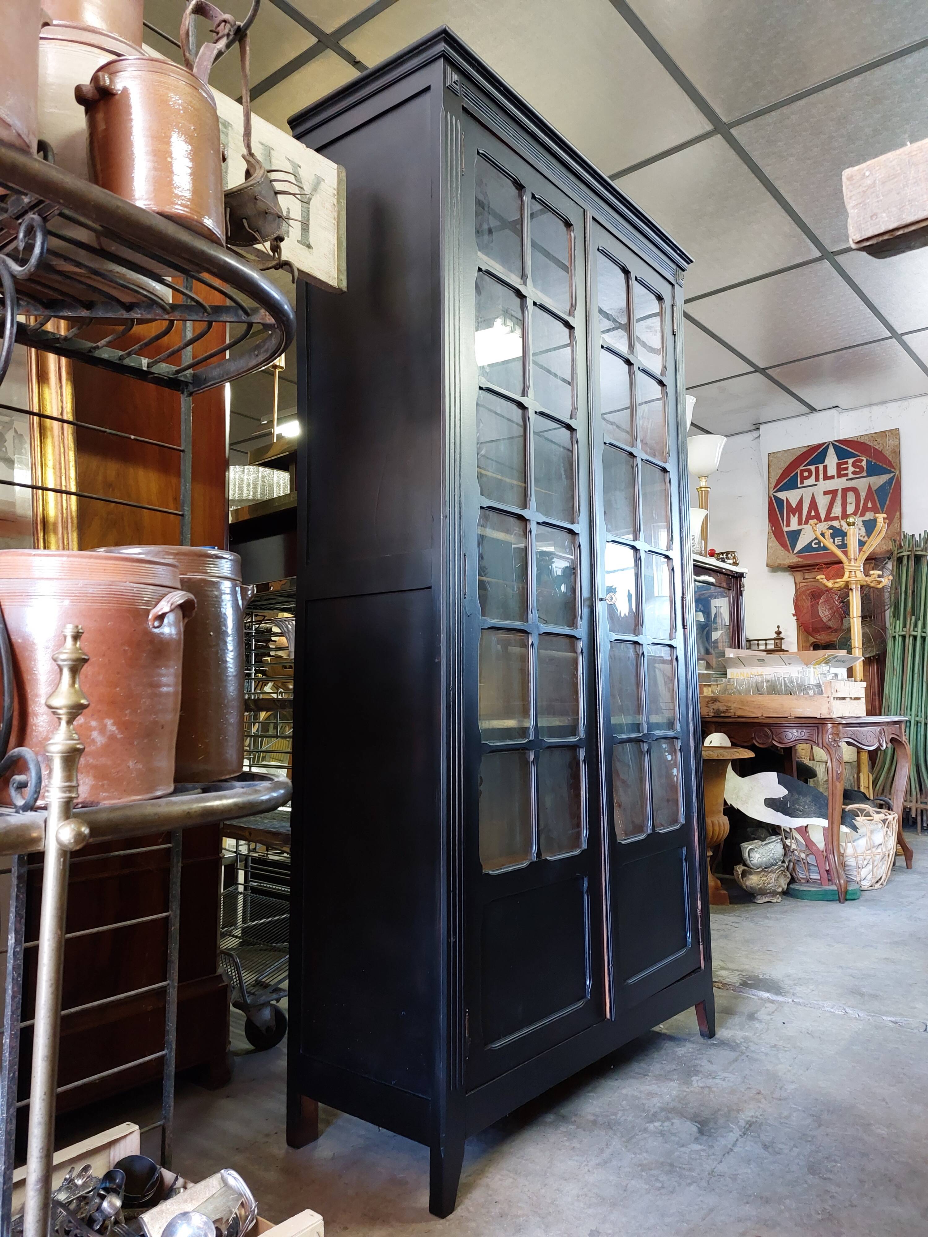 Parisian antique black patinated showcase